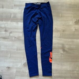 Blue Nike leggings with a Nike logo on the back